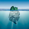 Green island above water reveals plastic waste underwater, environmental metaphor
