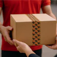 Cardboard package with branded shipping tape being exchanged between two people