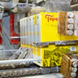 Mediante la implementación de EcoStitch de Valco Melton, Topo Chico redujo el 55 % de adhesivo en el pegado hot melt de cajas con botellas de agua.