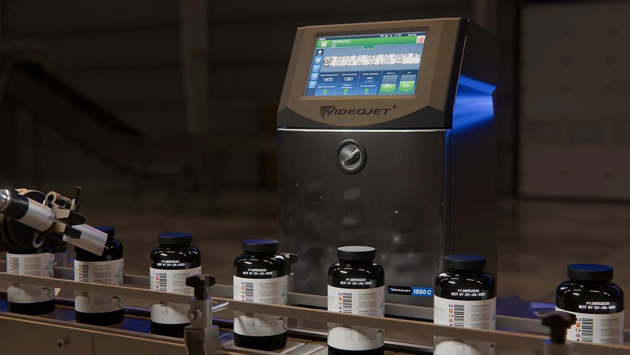 VideoJet industrial inkjet printer with display screen and ink bottles arranged on conveyor line