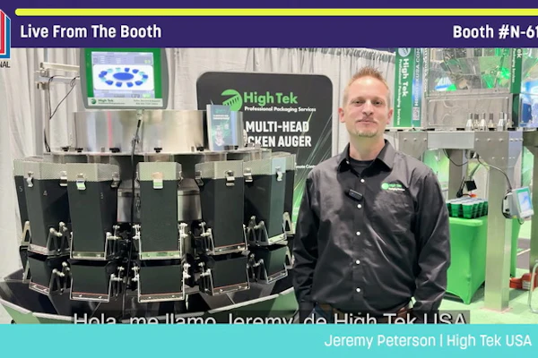 Jeremy Peterson from High Tek USA demonstrates multi-head specimen auger equipment at Pack Expo booth N-6149