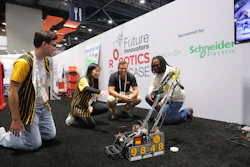 Team members demonstrate a robotics competition robot at the Future Innovators Robotics Showcase, sponsored by Schneider Electric.