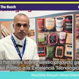 Man in white shirt at Pack Expo booth W-15107 discussing award-winning technology with packaged food products displayed behind him