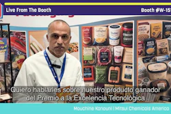 Man in white shirt at Pack Expo booth W-15107 discussing award-winning technology with packaged food products displayed behind him