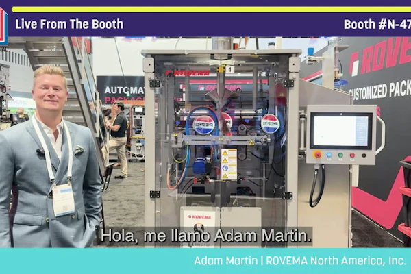 Adam Martin from ROVEMA North America at Pack Expo booth N-4752, standing before automated packaging machinery and customized packaging equipment display.